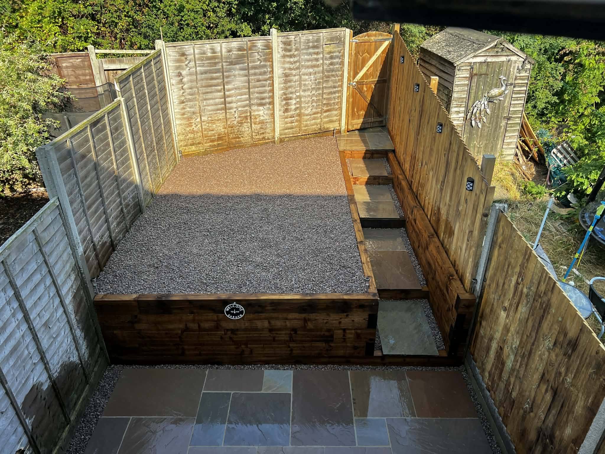 Newton Flotman garden transformation with sleeper walls and sandstone patio