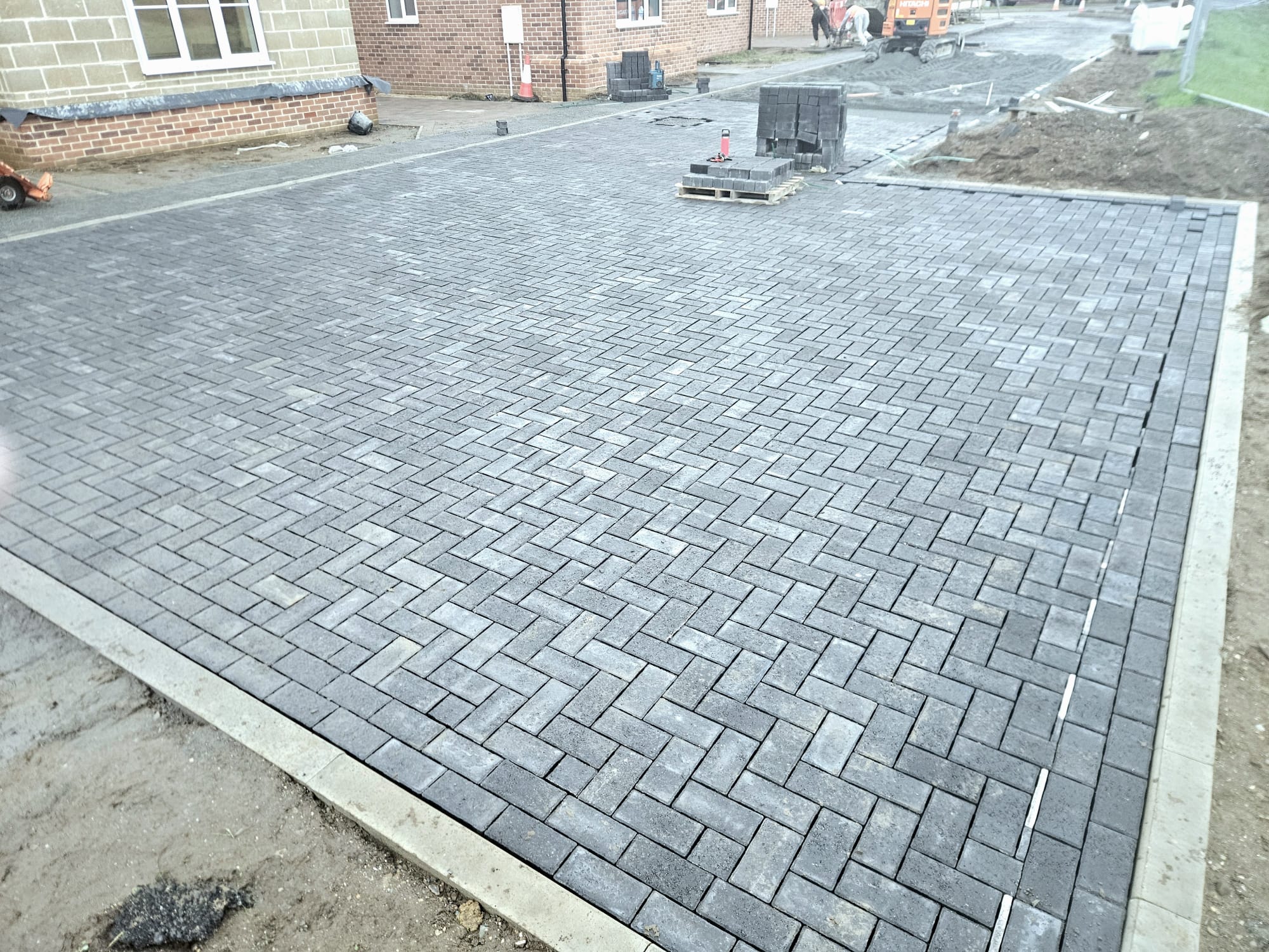 Yaxham cul-de-sac excavated and re-laid with brick paving